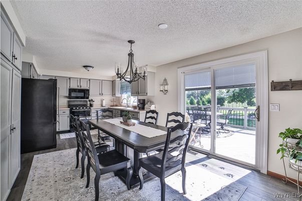 Chandelier, Dining room, Interior, Kitchen, Stainless Steel Appliances, Wood Texture Flooring