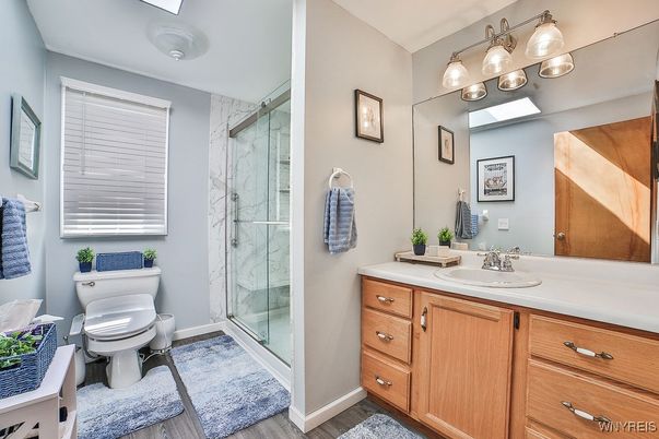 Bathroom, Glass Shower, Interior, Marble Walls, Wood Texture Flooring