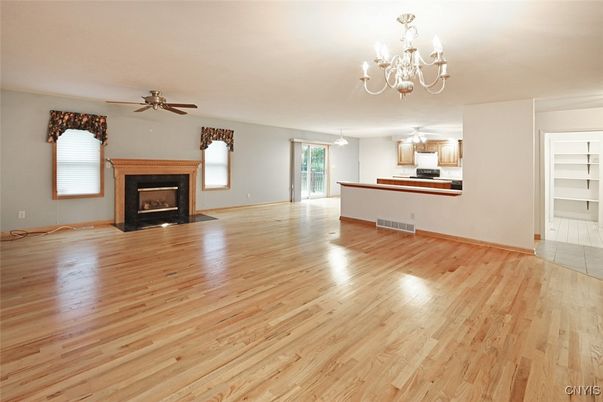 Chandelier, Empty room, Fireplace, Interior, Kitchen, Wood Texture Flooring