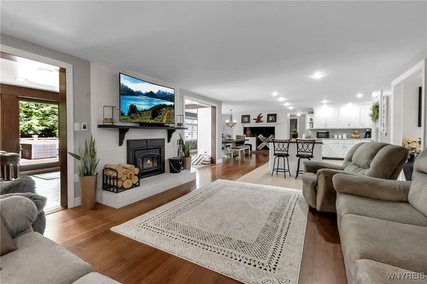 Chandelier, Dining room, Fireplace, Interior, Kitchen, Living room, Recessed Lighting, Wood Texture Flooring