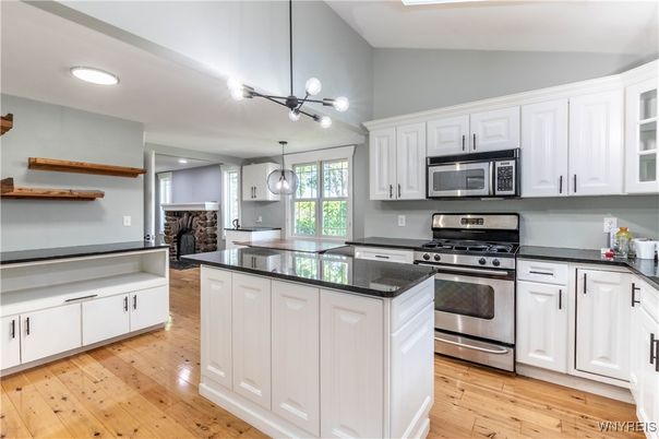 Fireplace, Interior, Kitchen, Pendant Lights, Recessed Lighting, Stainless Steel Appliances, Wood Texture Flooring