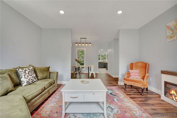 Dining room, Fireplace, Interior, Living room, Pendant Lights, Recessed Lighting, Wood Texture Flooring