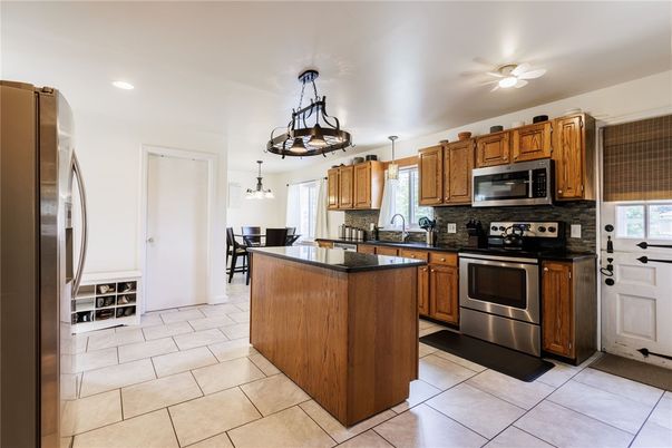 Chandelier, Dining room, Interior, Kitchen, Pendant Lights, Recessed Lighting, Stainless Steel Appliances