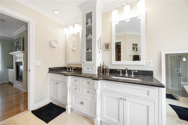Bathroom, Dual Sink Vanities, Glass Shower, Interior, Recessed Lighting, Wood Texture Flooring