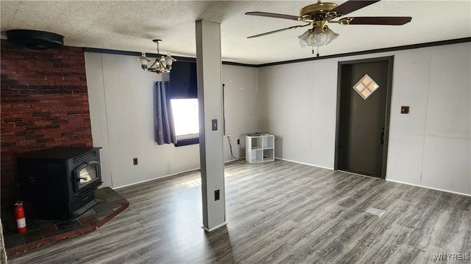 Chandelier, Empty room, Fireplace, Interior, Pendant Lights, Stone Walls, Wood Texture Flooring