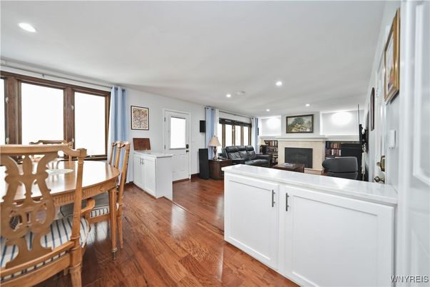Dining room, Fireplace, Interior, Living room, Recessed Lighting, Wood Texture Flooring