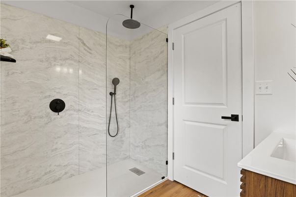 Bathroom, Glass Shower, Interior, Marble Walls, Wood Texture Flooring