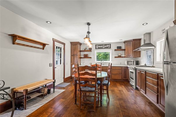 Dining room, Interior, Kitchen, Pendant Lights, Recessed Lighting, Stainless Steel Appliances, Wood Texture Flooring