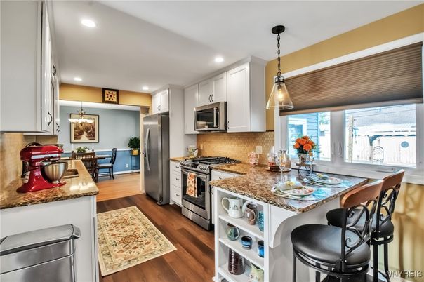 Dining room, Interior, Kitchen, Pendant Lights, Recessed Lighting, Stainless Steel Appliances, Wood Texture Flooring