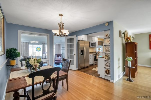Chandelier, Dining room, Interior, Kitchen, Stainless Steel Appliances, Wood Texture Flooring
