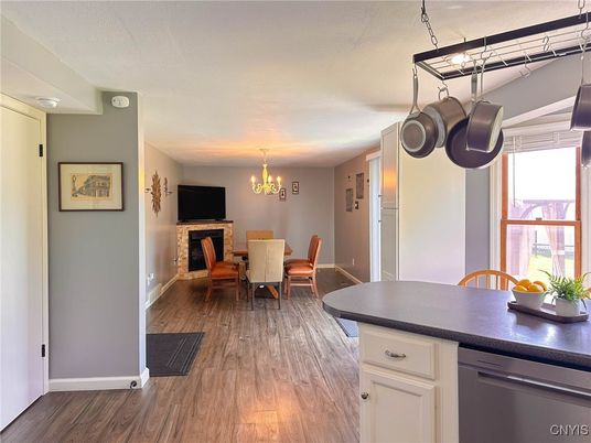 Chandelier, Dining room, Fireplace, Interior, Kitchen, Wood Texture Flooring