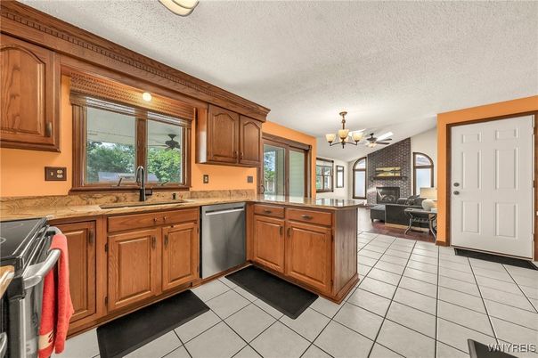 Chandelier, Dining room, Fireplace, Interior, Kitchen, Stainless Steel Appliances