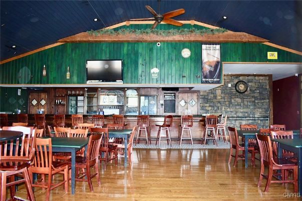 Dining room, Fireplace, Interior, Recessed Lighting, Stone Walls, Wood Texture Flooring, Wooden Walls