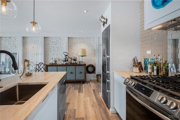 Interior, Kitchen, Pendant Lights, Recessed Lighting, Stainless Steel Appliances, Stone Walls, Wood Texture Flooring