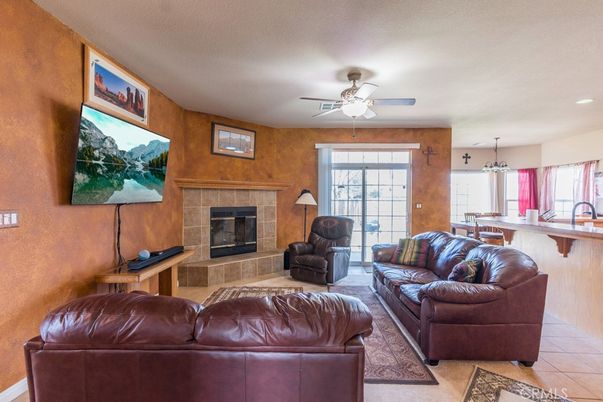 Chandelier, Dining room, Fireplace, Interior, Living room, Pendant Lights, Recessed Lighting, Wooden Walls
