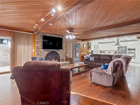 Fireplace, Interior, Kitchen, Living room, Recessed Lighting, Stainless Steel Appliances, Stone Walls, Wooden Ceilings, Wood Texture Flooring