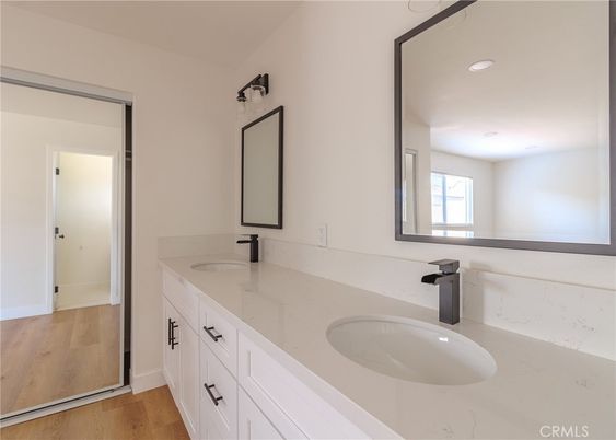 Bathroom, Dual Sink Vanities, Interior, Recessed Lighting, Wood Texture Flooring
