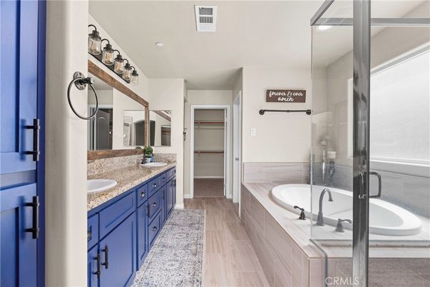 Bathroom, Dual Sink Vanities, Glass Shower, Interior, Recessed Lighting, Wood Texture Flooring