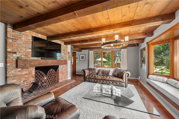 Chandelier, Fireplace, Interior, Living room, Stone Walls, Wooden Beams, Wooden Ceilings, Wood Texture Flooring