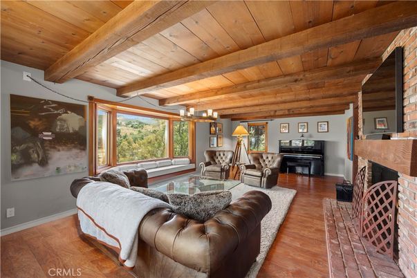 Chandelier, Fireplace, Interior, Living room, Piano, Wooden Beams, Wooden Ceilings, Wood Texture Flooring