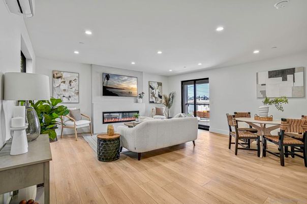 Dining room, Fireplace, Interior, Living room, Recessed Lighting, Wood Texture Flooring