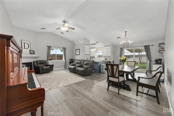 Chandelier, Dining room, Fireplace, Interior, Kitchen, Living room, Pendant Lights, Piano, Wood Texture Flooring