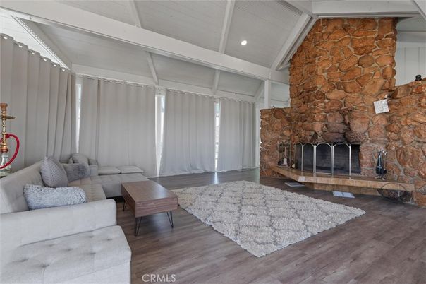 Fireplace, Interior, Living room, Recessed Lighting, Stone Walls, Wood Texture Flooring
