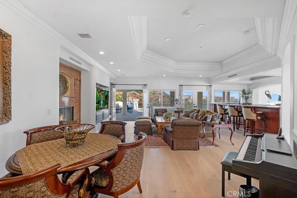 Dining room, Fireplace, Interior, Living room, Piano, Recessed Lighting, Wood Texture Flooring