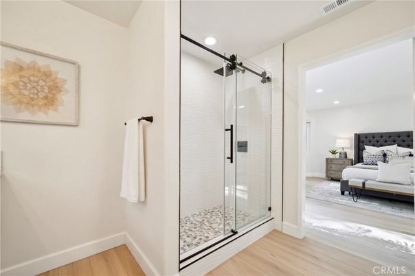 Bathroom, Bedroom, Glass Shower, Interior, Recessed Lighting, Wood Texture Flooring