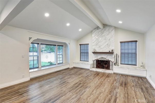 Empty room, Fireplace, Interior, Marble Walls, Recessed Lighting, Wood Texture Flooring
