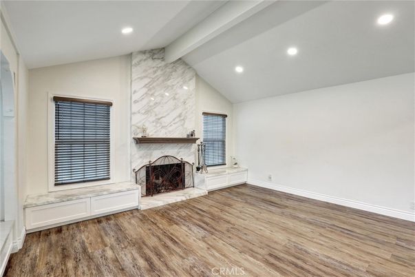 Empty room, Fireplace, Interior, Marble Walls, Recessed Lighting, Wood Texture Flooring