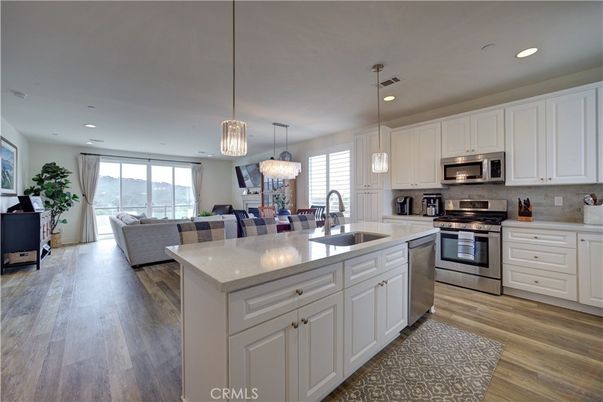 Dining room, Interior, Kitchen, Living room, Pendant Lights, Recessed Lighting, Stainless Steel Appliances, Wood Texture Flooring