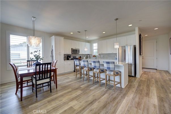 Dining room, Interior, Kitchen, Pendant Lights, Recessed Lighting, Stainless Steel Appliances, Wood Texture Flooring