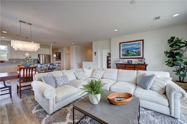 Chandelier, Dining room, Interior, Kitchen, Living room, Pendant Lights, Recessed Lighting, Stainless Steel Appliances, Wood Texture Flooring