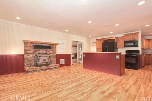 Fireplace, Interior, Kitchen, Recessed Lighting, Stone Walls, Wood Texture Flooring