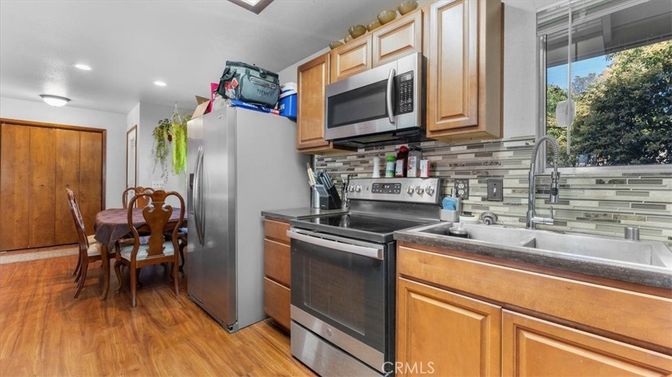 Dining room, Interior, Kitchen, Recessed Lighting, Stainless Steel Appliances, Wood Texture Flooring