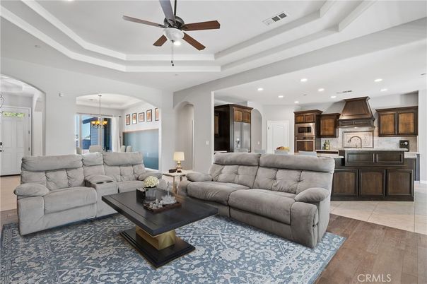 Chandelier, Dining room, Interior, Kitchen, Living room, Pendant Lights, Recessed Lighting, Stainless Steel Appliances, Wood Texture Flooring