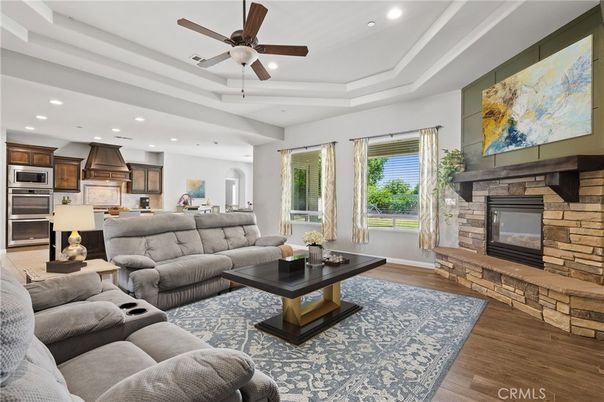 Fireplace, Interior, Kitchen, Living room, Recessed Lighting, Stainless Steel Appliances, Stone Walls, Wood Texture Flooring