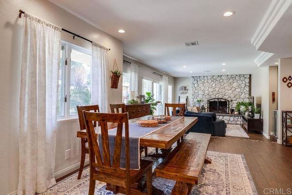 Dining room, Fireplace, Interior, Recessed Lighting, Stone Walls, Wood Texture Flooring