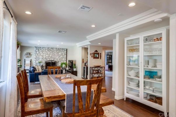 Dining room, Fireplace, Interior, Recessed Lighting, Stone Walls, Wood Texture Flooring