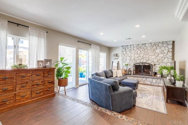 Fireplace, Interior, Living room, Recessed Lighting, Stone Walls, Wood Texture Flooring