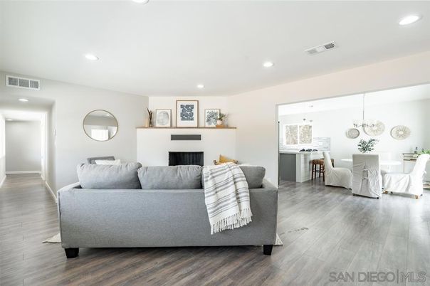 Dining room, Fireplace, Interior, Living room, Pendant Lights, Recessed Lighting, Wood Texture Flooring