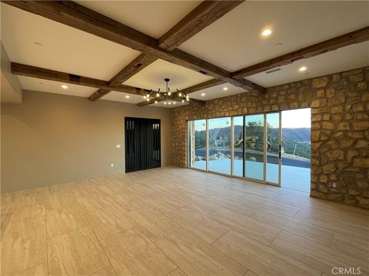 Chandelier, Empty room, Interior, Recessed Lighting, Stone Walls, Wooden Beams, Wood Texture Flooring