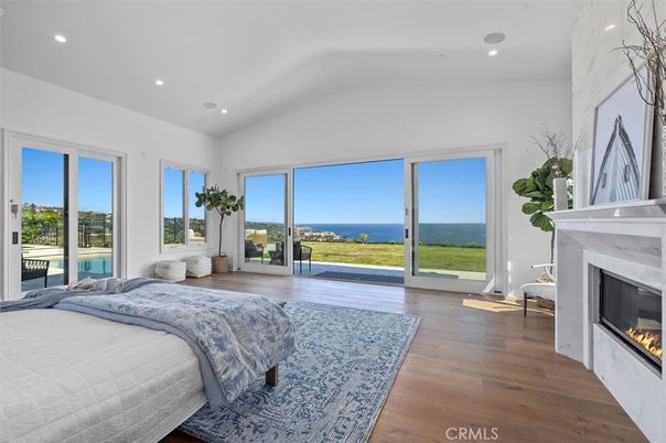 Bedroom, Fireplace, Interior, Recessed Lighting, Water, Wood Texture Flooring