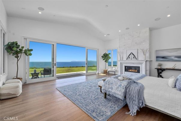 Bedroom, Fireplace, Interior, Recessed Lighting, Water, Wood Texture Flooring