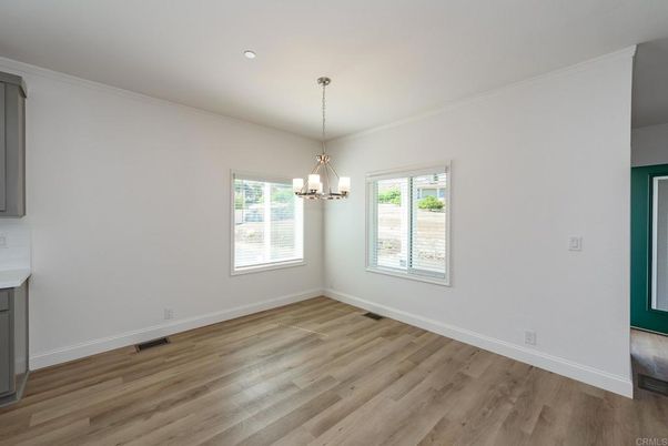 Chandelier, Empty room, Fireplace, Interior, Pendant Lights, Recessed Lighting, Wood Texture Flooring