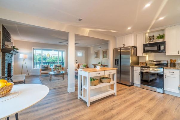 Dining room, Interior, Kitchen, Living room, Recessed Lighting, Stainless Steel Appliances, Wood Texture Flooring