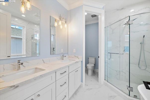 Bathroom, Dual Sink Vanities, Glass Shower, Interior, Marble, Marble Walls, Recessed Lighting