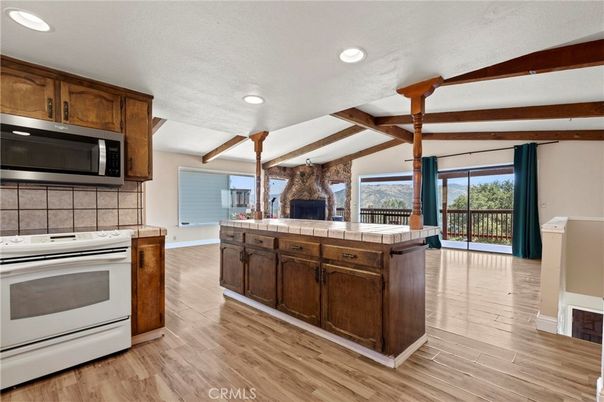 Fireplace, Interior, Kitchen, Recessed Lighting, Tile Countertops, Wooden Beams, Wood Texture Flooring