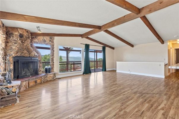 Empty room, Fireplace, Interior, Stone Walls, Wooden Beams, Wood Texture Flooring